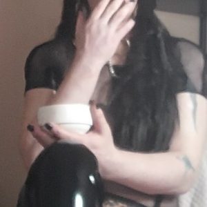 Smoking Shemale Mistress TS KittyKat blows her smoke in your face as you kneel at her feet